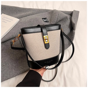 Vintage leopard canvas bucket bag with black leather trim and gold twist lock closure