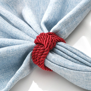 Elegant red woven knot napkin ring handcrafted for high-end dining and hotel decor