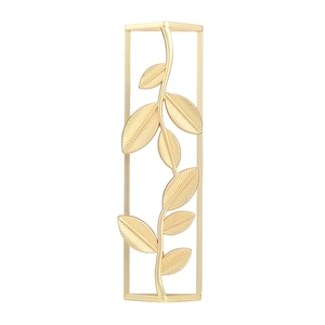 Detail of matte gold metal napkin ring featuring leaf branch within a rectangular frame