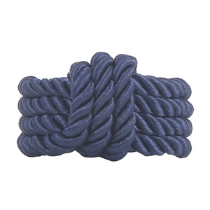 Handcrafted navy blue woven rope napkin ring with a polished glossy finish on white backdrop