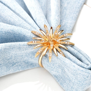 Golden sunburst napkin ring with sparkling crystals for luxury table setting decoration
