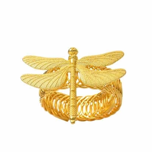 Detailed view of a vintage gold dragonfly ring with intricate mesh wings and a woven band
