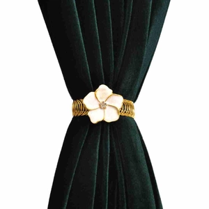 Golden spring curtain tieback with white flower and crystal on green velvet drapes