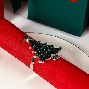 Silver Christmas tree napkin ring with green enamel finish and star for festive table decor