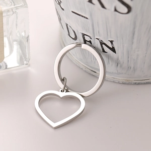 Minimalist silver stainless steel keychain with hollow heart pendant and polished finish