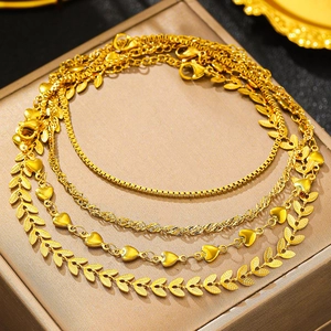 Three-piece gold layered anklet set with wheat chain and round tassel charms