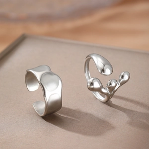 Minimalist irregular wavy silver stainless steel open rings with polished droplet texture