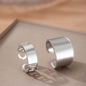 Polished stainless steel wide band rings with chain elements and beaded edges