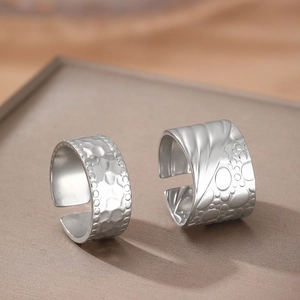 Minimalist silver stainless steel open ring set with hammered and embossed metal textures