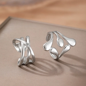 Minimalist 304 stainless steel rings with modern organic curved design and liquid metal texture