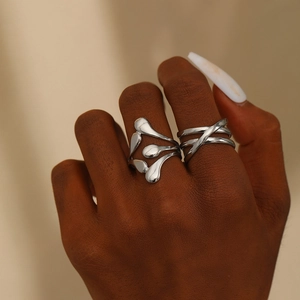 Minimalist silver liquid metal ring set with irregular droplet and triple-layered crossover design