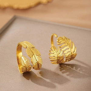 Exaggerated golden stainless steel feather and palm leaf open rings with matte finish