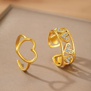 Gold-toned adjustable heart ring set featuring micro-paved cubic zirconia stones