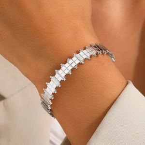 Modern geometric silver titanium steel bangle with checkered pattern and beaded edges