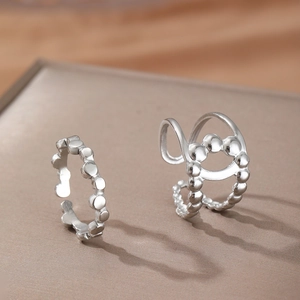 Minimalist silver beaded rings set in 18k gold style featuring open adjustable bands