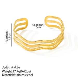 Golden stainless steel adjustable C-shape bangle with wavy hammered texture