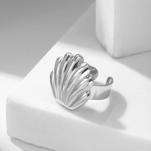 Minimalist silver scallop shell ring with adjustable open band and ribbed texture