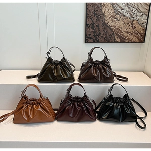 Detailed display of five stylish pleated cloud bags in olive, brown, and burgundy colors