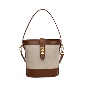 Sac seau rétro en toile et cuir marron avec fermoir tournant doré et bandoulière réglable