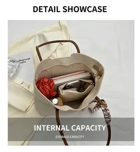 Top view of beige tote bag interior showing large capacity for umbrella and tablet
