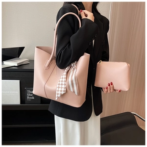 Detail of pink tote bag with chic striped silk scarf and matching inner pouch set