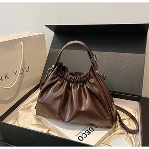 Dark brown pleated cloud bag in premium gift box with satin lining and silver hardware
