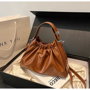 Brown pleated cloud handbag in a black gift box with silk lining and elegant chain strap