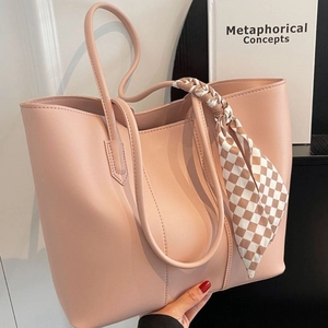 Pink leather tote bag with checkerboard scarf detail and large capacity for daily commute