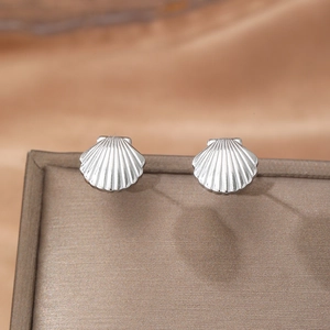 Marine style seashell stud earrings in silver finish on a premium velvet display case