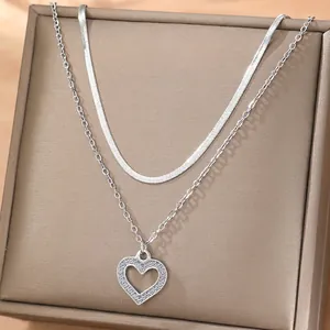 Silver layered 18K gold plated necklace with hollow heart zircon pendant on display box