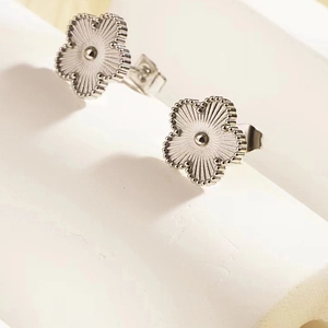 Elegant silver stainless steel five-petal flower stud earrings with radial patterns