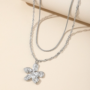 Double layered silver necklace with a large wrinkled flower petal pendant for women