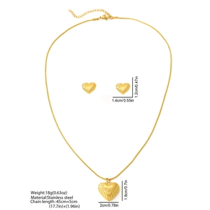Detail view of heart pendant jewelry set showing precise dimensions and stainless steel texture