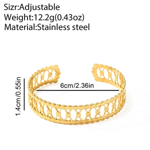 Macro detail of golden stainless steel hollow wave cuff with 1.4cm width and 12.2g weight