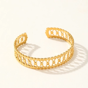 Wide geometric hollow mesh gold-plated stainless steel open cuff bracelet on white base