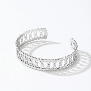 Polished silver stainless steel cuff bracelet with geometric hollow woven design