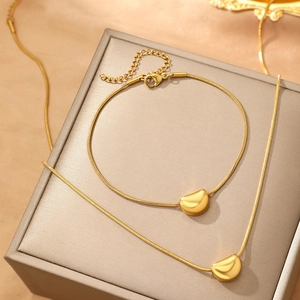 Elegant gold-plated snake chain necklace and bracelet set with polished bean pendants