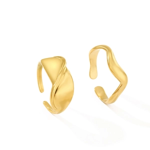 Minimalist gold S-shaped wavy open ring with polished surface on white background