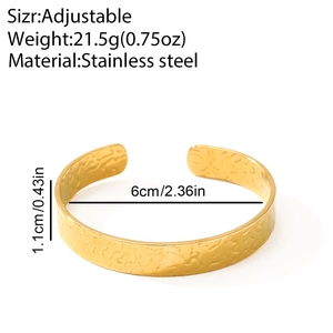 Detail of 1.1cm wide gold hammered stainless steel cuff with adjustable 6cm diameter