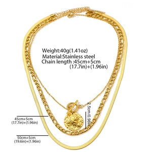Detailed view of triple-layered gold stainless steel necklace with OT buckle and round pendant