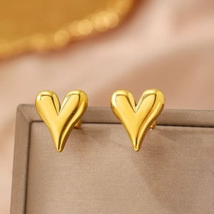 Elegant gold heart-shaped stud earrings with a high-shine polished metallic finish