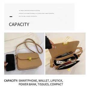 Detail view of khaki crossbody bag with compartments and size comparison with phone