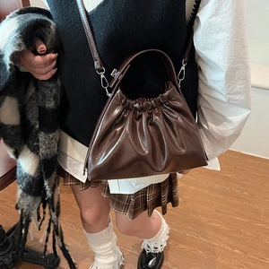 Coffee brown pleated cloud bag in glossy leather with handle and shoulder strap