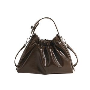 Fashionable dark brown pleated cloud bag with glossy oil wax finish and silver metal hooks
