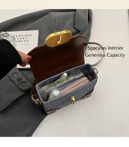 Denim crossbody bag interior showing storage space for phone, wallet and cosmetics