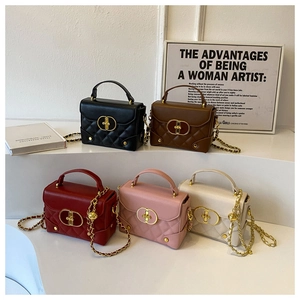 Five colors of elegant quilted crossbody bags with golden locks displayed on steps