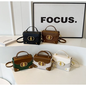 Detail showing five elegant mini square bags in assorted colors with gold twist locks