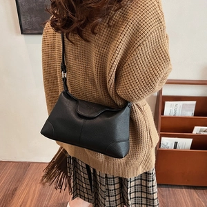 Classic black lychee pattern leather shoulder bag with adjustable strap and flap closure