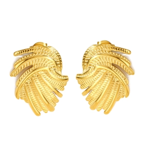 Elegant gold swirl earrings with radial textured petal design in retro fashion style