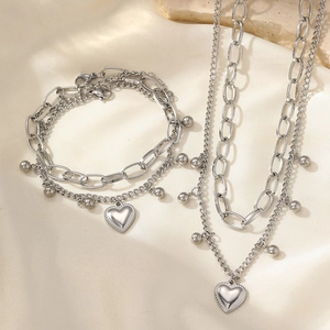 Parure de bijoux double couche avec collier et bracelet en acier et pendentifs cœur